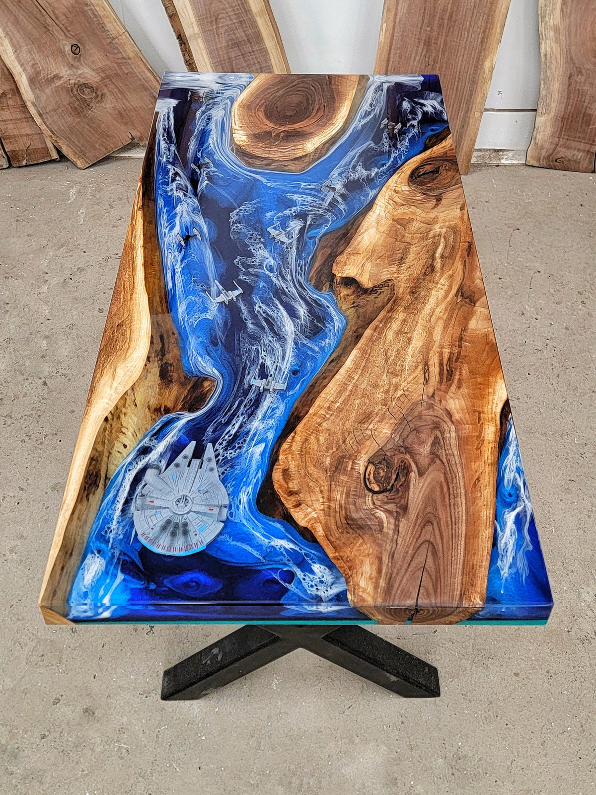 Walnut desk with blue ocean-inspired epoxy design with embedded Star Wars ships