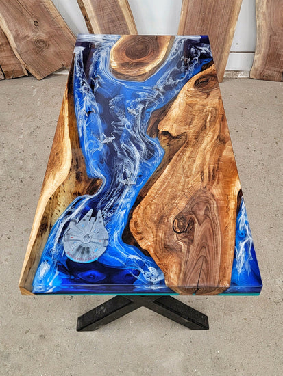 Walnut desk with blue ocean-inspired epoxy design with embedded Star Wars ships