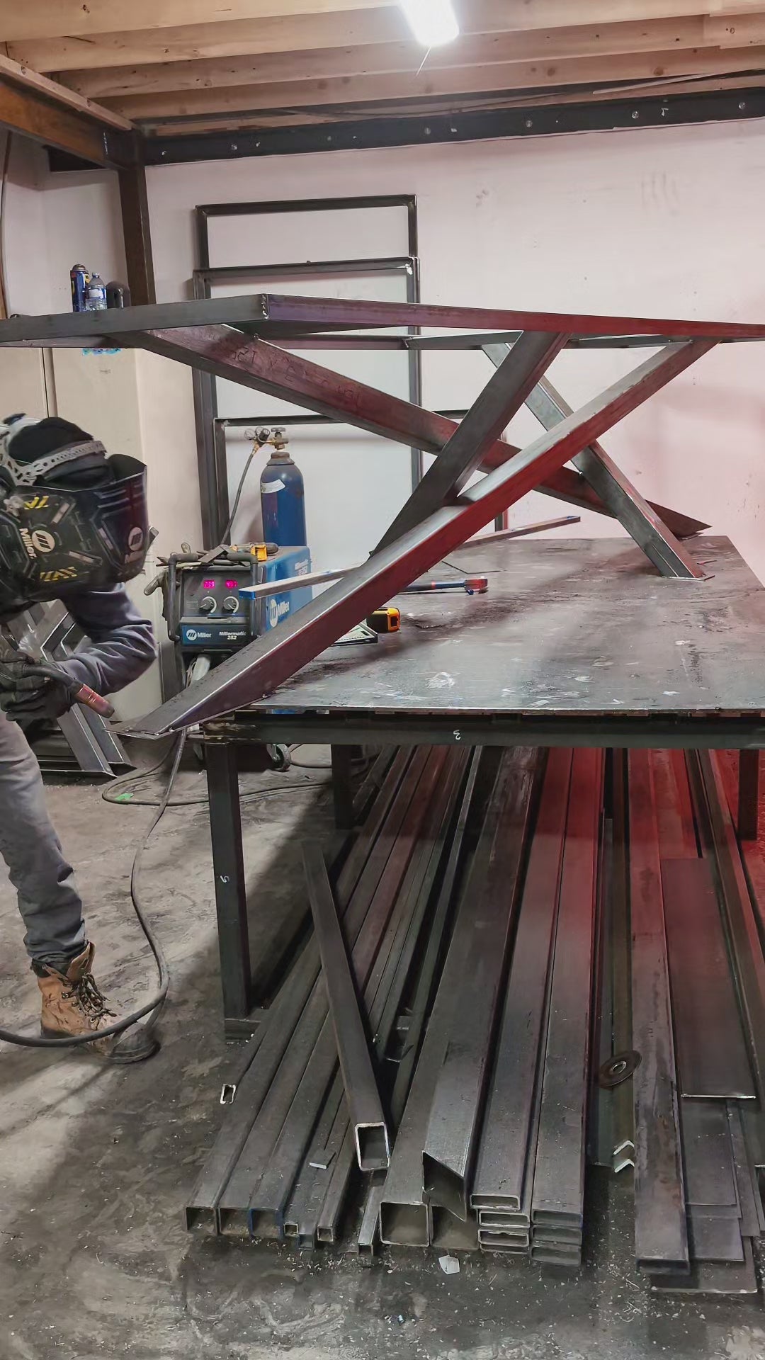 Video of our in-house welder creating a table-base in our shop at Backyard Resin