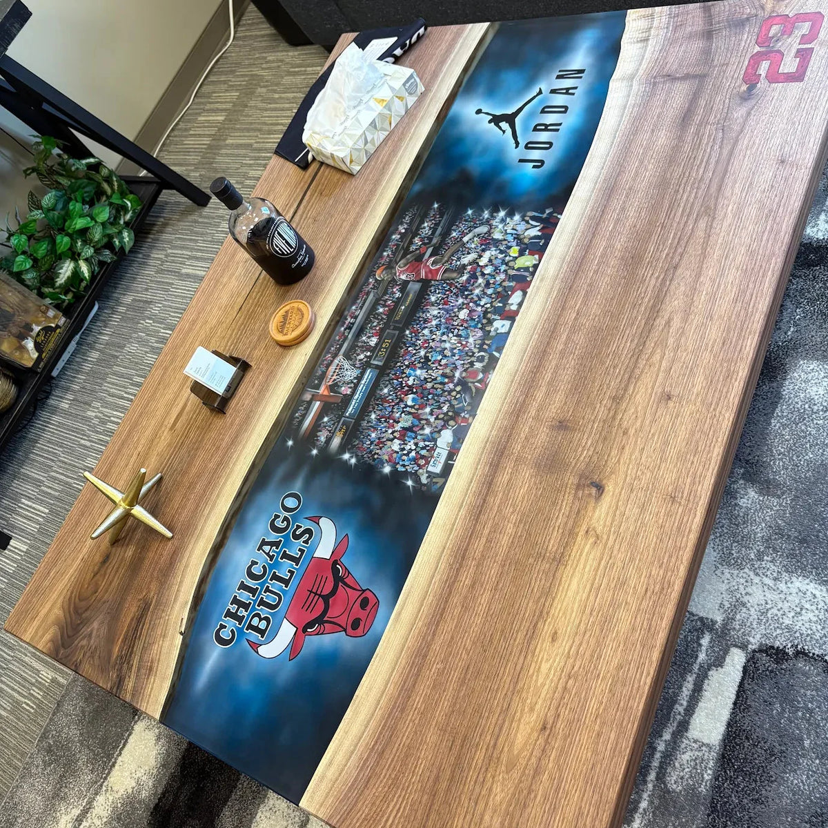 Wooden coffee table with sports-themed Chicago Bulls Michael Jordan airbrush design in a customer's living room setting